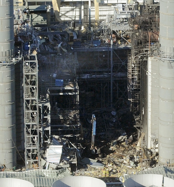 In this Feb. 7, 2010 file photo, damage is visible at the Kleen Energy plant after an explosion in Middletown, Conn. Six people were killed in the blast. The state Supreme Court ruled Wednesday, July 27, 2016, that two workers injured in the explosion cannot sue the contractor for negligence because they already had received workers' compensation benefits. (AP Photo/Jessica Hill, File)