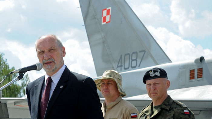 (AP) Polish Defense Minister Antoni Macierewicz speaks before a Polish Air Force F-16 fighter jet during a farewell ceremony of Polish soldiers leaving for Kuwait to take part in the operation Inherent Resolve , in Janow, Poland, Monday, July 4, 2016.