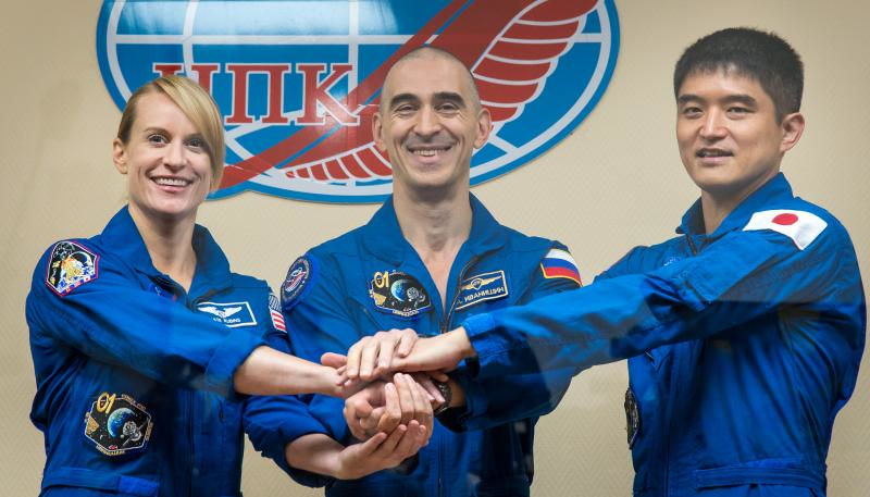 (From left) Expedition 48-49 crew members Kate Rubins, Anatoly Ivanishin and Takuya Onishi pose for a group photograph following the crew press conference at the Cosmonaut Hotel in Baikonur, Kazakhstan. (Image credit: NASA/Bill Ingalls)