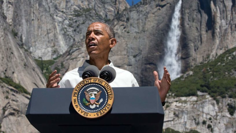 President Barack Obama speaks by the Sentinel Bridge in the Yosemite Valley, in front of Yosemite Falls which is the highest waterfall in the park at Yosemite National Park, Calif., on Saturday, June 18, 2016. (AP Photo/Jacquelyn Martin)