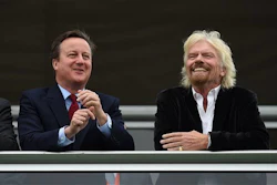 Britain's Prime Minister David Cameron, left, and Virgin boss Richard Branson at the Farnborough International Airshow in Farnorough, south England, Monday July 11, 2016. (Andrew Matthews / PA via AP)