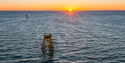The sun is rising ove America’s firts offshore wind farm. Deepwater Wind installed the bases for all five wind turbines last fall. (Image credit: Deepwater Wind)