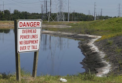 A lawsuit has gone to a judge over environmentalists claim that there are leaks of arsenic and other heavy metals into a river near Dominion's abandoned Chesapeake power plant in violation of the Clean Water Act. (AP Photo/Steve Helber)