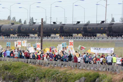 Anti-oil protestors walk past the Tesoro refinery rail yard in Anacortes, Wash. (Scott Terrell/Skagit Valley Herald via AP, File)