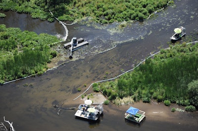 A nearly 40-mile stretch of the Kalamazoo River was polluted as shoreline residents fled their homes. (AP Photo/Joe Raymond, FILE)