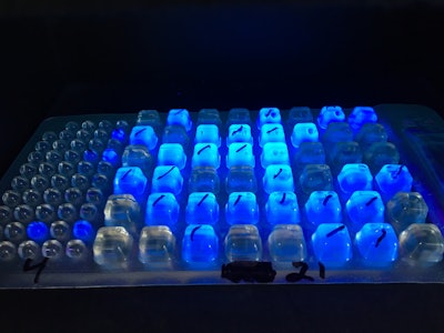 A tray containing a water sample from the Hudson River is viewed in an ultraviolet light box onboard Riverkeeper's pollution patrol boat, Tuesday, Aug. 23, 2016 in Mechanicville, N.Y. After nearly a decade of pollution patrols that have spurred sewage cleanup efforts on the Hudson River from the Albany area to New York Harbor, the environmental group Riverkeeper is expanding its water quality testing program to the river's source high in the Adirondack Mountains. (AP Photo/Mary Esch)