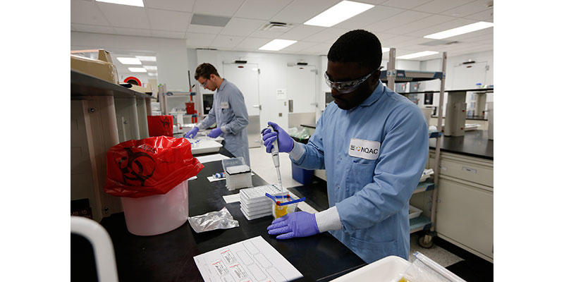 A Nestlé microbiologist tests a food sample for listeria in the Pathogens Lab at the Nestlé Quality Assurance Center in Dublin, OH. Photo by Jay LaPrete/AP