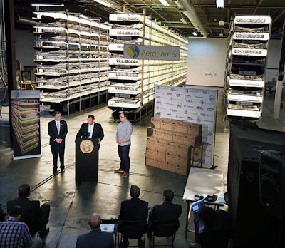 In this Thursday, March 24, 2016, file photograph, New Jersey Gov. Chris Christie, center at podium, addresses a gathering at AeroFarms, a vertical farming operation in Newark, N.J. AeroFarms is now refurbishing an old steel mill in New Jersey and they say it will soon be the site of the world's largest indoor vertical farm. The company says their Newark facility, set to open in September, could produce 2 million pounds of food per year and help with farming land loss and long-term food shortages. (AP Photo/Mel Evans, File)
