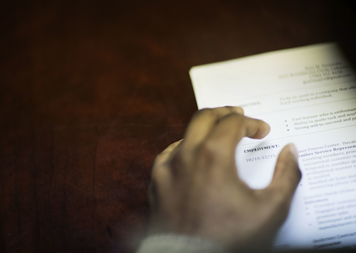In this Thursday, March 3, 2016, file photo, a job candidate's resume sits on a table as he interviews for a job with a restaurant during a recruiting event at the Georgia Department of Labor office, in Atlanta. The Labor Department reports Thursday, Aug. 4, 2016, on the number of Americans applying for unemployment benefits a week earlier. (AP Photo/David Goldman, File)