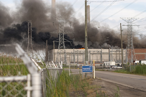 A fire rages at the DTE Energy St. Clair Power Plant Thursday, Aug 1l, 2016, in East China Township, Mich. The Times-Herald of Port Huron reports that multiple area fire agencies are responding Thursday evening to the DTE Energy St. Clair Power Plant, northeast of Detroit. A Marine City fire official has told WXYZ-TV that the plant is on fire. (Andrew Jowett/The Times Herald via AP)