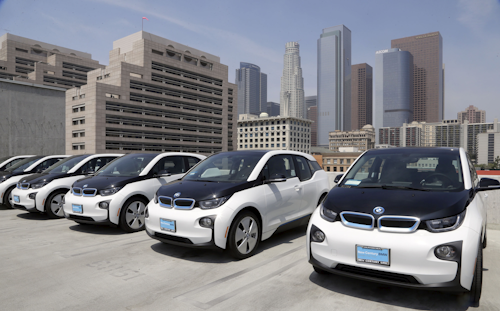This June 8, 2016 file photo shows electric cars parked atop the Los Angeles Police Department parking lot, in Los Angeles. A California lawmaker told The Associated Press on Friday, Aug. 12, that she's introducing legislation to require that 15 percent of new vehicles be emission-free in less than a decade, a significant escalation in the state's efforts to speed the evolution of new car technology. (AP Photo/Nick Ut,File)