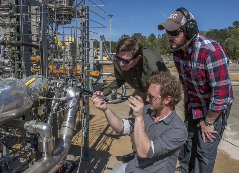 Engineers prepare a 3D printed turbopump for a test at NASA’s Marshall Space Flight Center in Huntsville, Alabama. (Image credit: NASA/MSFC/Emmett Given)