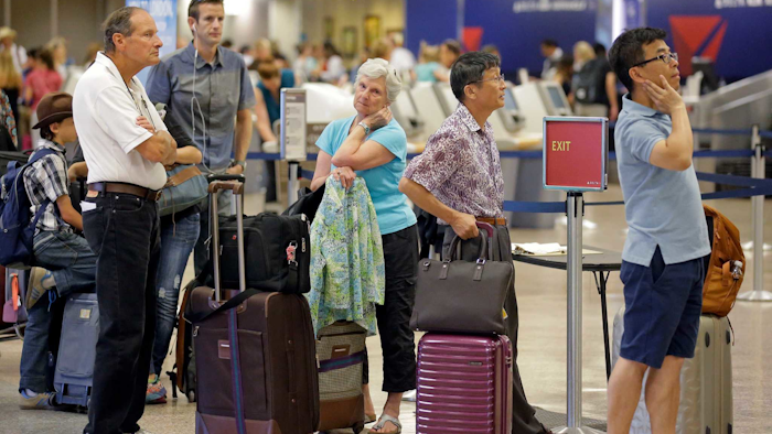 Nearly 1,200 Delta flights had been delayed, according to tracking service FlightStats Inc. (AP Photo/Rick Bowmer)