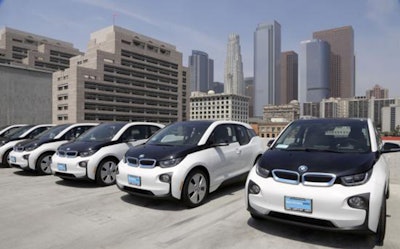 This June 8, 2016 file photo shows electric cars parked atop the Los Angeles Police Department parking lot, in Los Angeles. (AP Photo/Nick Ut,File)