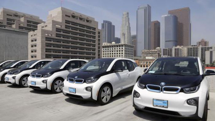 This June 8, 2016 file photo shows electric cars parked atop the Los Angeles Police Department parking lot, in Los Angeles. (AP Photo/Nick Ut,File)