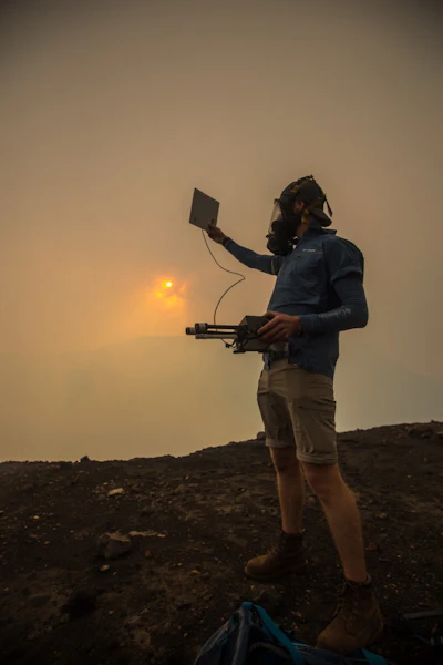 Hugo Nordell, the team’s lead engineer, is testing a solar panel for one of the sensors at the lip of the crater. (Image credit: @tmophotos, Qwake via GE Reports)