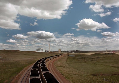A pair of coal trains idle on the tracks near Dry Fork Station, a coal-fired power plant being built by the Basin Electric Power Cooperative near Gillette, Wyo. (AP Photo/Matthew Brown, File)