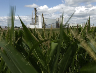 An ethanol plant stands next to a cornfield near Nevada, Iowa. (AP Photo/Charlie Riedel, File)