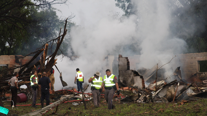 Authorities work the scene after a truck carrying Takata inflators and a volatile chemical exploded in the Texas border town of Quemado, killing a woman and injuring four others. (Ruben Carrillo Mazuka/The Eagle Pass News Gram via AP)