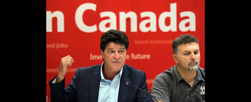 Unifor national president Jerry Dias, left, accompanied by members of the bargaining committees of Ford and Fiat Chrysler, speaks during a news conference regarding the ongoing Canadian Auto Workers union talks, Thursday, Aug. 11, 2016. in Toronto. (Nathan Denette/The Canadian Press via AP)