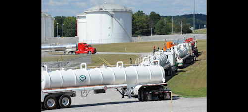 Tanker trucks line up at a Colonial Pipeline Co. facility in Pelham, Ala., near the scene of a 250,000-gallon gasoline spill on Friday, Sept. 16, 2016. The company says spilled gasoline is being taken to the storage facility for storage. Some motorists could pay a little more for gasoline in coming days because of delivery delays. (AP Photo/Jay Reeves)