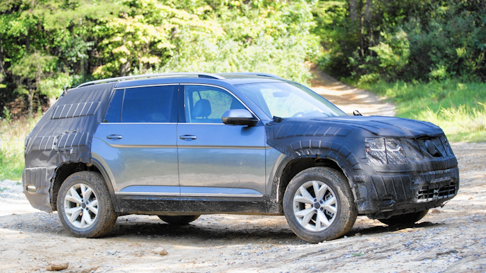 A camouflaged prototype of Volkswagen's new midsized SUV is seen on an off road trail at Prentice Cooper State Forest near Chattanooga, Tenn., Monday, Aug. 29, 2016. The German automaker plans to begin production of the new model at it Chattanooga plant later this year. (AP Photo/Erik Schelzig)