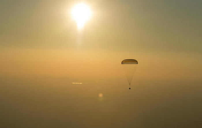 This photo provided by NASA shows the Soyuz TMA-20M spacecraft as it lands with Expedition 48 crew members NASA astronaut Jeff Williams, Russian cosmonauts Alexey Ovchinin, and Oleg Skripochka of Roscosmos near the town of Zhezkazgan, Kazakhstan, Wednesday, Sept. 7, 2016. (Bill Ingalls/NASA via AP)