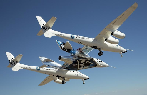 The SpaceShipTwo and and launch vehicle in the 'captive carry' test on Friday. (Image credit: Virgin Galactic)