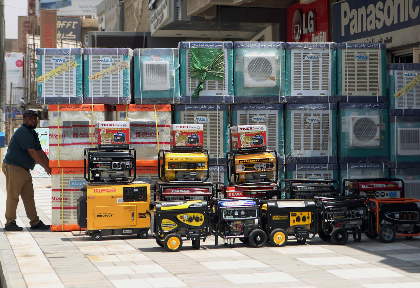 Air conditioners and power generators are displayed on a street in central Baghdad, Iraq. Nations reached a deal Saturday, Oct. 15, 2016 to limit the use of hydrofluorocarbons, or HFCs - greenhouse gases far more powerful than carbon dioxide that are used in air conditioners and refrigerators, in a major effort to fight climate change. (AP Photo/ Khalid Mohammed, File)