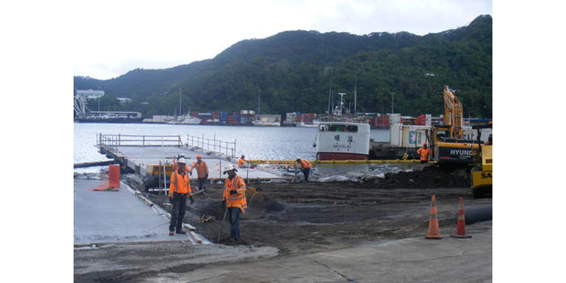 In this photo taken Nov. 28, 2014, construction on a new unloading dock is underway at Tri Marine International's Samoa Tuna Processors Inc., plant under construction in the U.S. territory of American Samoa. In a statement, Tri Marine says it will end production indefinitely at its Samoa Tuna Processors cannery plant. The company’s 800 employees were informed of the plan Thursday, Oct. 13, 2016. The company didn’t specify how many will be affected. (AP Photo/Fili Sagapolutele)