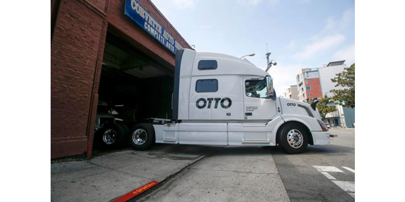 In this Aug. 18, 2016, file photo, one of Otto's self-driving, big-rig trucks leaves the garage for a test drive during a demonstration at the Otto headquarters in San Francisco. Anheuser-Busch announced on Oct. 25, 2016, that it teamed up with Otto for a 120-plus mile beer delivery that marked the world's first by a self-driving truck. (AP Photo/Tony Avelar, File)