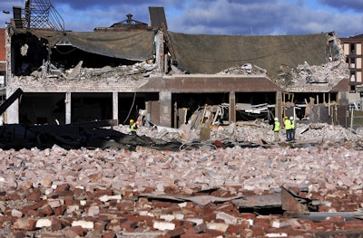 In this Nov. 24, 2012 file photo, inspectors assess damage around the area of a gas explosion that leveled a strip club in Springfield, Mass., on Nov. 23. New or replaced gas service lines for apartments and small businesses across the United States must be equipped with inexpensive safety valves starting next year following deadly fires and explosions over decades that could have been avoided, the Obama administration announced Tuesday, Oct. 11, 2016. (AP Photo/Jessica Hill, File)