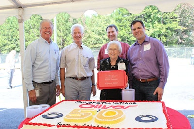 Oliver Rubber executives at the 50th Anniversary Celebration: John Revell, Oliver Rubber plant manager, Philippe Sebaux, director of industry for Michelin Americas Truck Tires, Welta Harrelson and Mark Harrelson, family members of founder Harrelson Rubber, and Ralph Dimenna, chief operating officer of Michelin Americas Truck Tires.