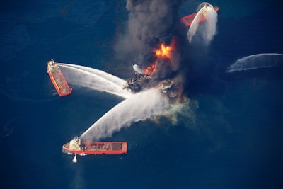 In this April 21, 2010, aerial file photo, the Deepwater Horizon oil rig burns in the Gulf of Mexico, more than 50 miles southeast of Venice on Louisiana's tip. (AP Photo/Gerald Herbert, File)