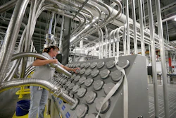 Susan Stacy moves a tube to sort recycled plastic bottle chips being processed at the Repreve Bottle Processing Center, part of the Unifi textile company in Yadkinville, N.C., Friday, Oct. 21, 2016. America has lost more than 7 million factory jobs since manufacturing employment peaked in 1979. Yet American factory production, minus raw materials and some other costs, more than doubled over the same span to $1.91 trillion last year, according to the Commerce Department, which uses 2009 dollars to adjust for inflation. That’s a notch below the record set on the eve of the Great Recession in 2007. And it makes U.S. manufacturers No. 2 in the world behind China. (AP Photo/Chuck Burton)