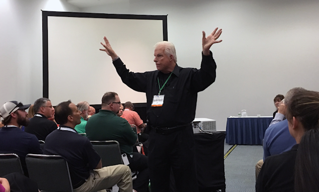 Former Exxon oil refinery worker and current motivational speaker Charlie Morecraft presenting to the crowd at NSC on Oct. 17 in Anaheim, CA. (ID photo)