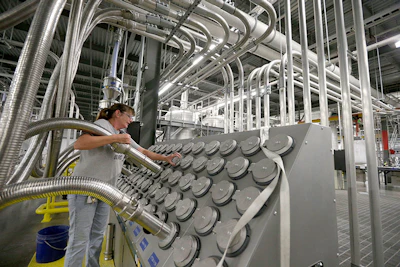 Susan Stacy moves a tube to sort recycled plastic bottle chips being processed at the Repreve Bottle Processing Center, part of the Unifi textile company in Yadkinville, N.C., Friday, Oct. 21, 2016. America has lost more than 7 million factory jobs since manufacturing employment peaked in 1979. Yet American factory production, minus raw materials and some other costs, more than doubled over the same span to $1.91 trillion last year, according to the Commerce Department, which uses 2009 dollars to adjust for inflation. That’s a notch below the record set on the eve of the Great Recession in 2007. And it makes U.S. manufacturers No. 2 in the world behind China. (AP Photo/Chuck Burton)