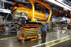 A battery is lifted into place for installation in the Chevrolet Bolt EV at the General Motors Orion Assembly plant Friday, Nov. 4, 2016, in Orion Township, Mich. (AP Photo/Duane Burleson)