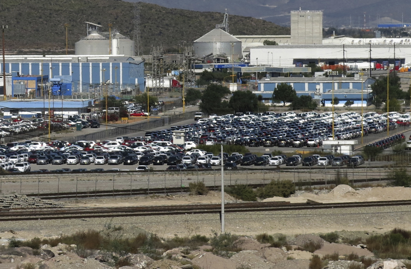 Cars sit at the General Motors plant where Chevrolet Sonics, Cadillac SRXs and Captiva SUVs are assembled in Ramos Arizpe, Mexico. U.S. President-elect Donald Trump’s election could bring some upheaval to the U.S. auto industry, which helped to lead the nation out of the Great Recession as U.S. sales rebounded. The industry is waiting to see if Trump will make good on promises to redo trade agreements and slap tariffs on cars manufactured in Mexico. (AP Photo/Marco Ugarte, File)