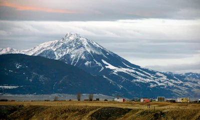 This Nov. 21, 2016 file photo shows Emigrant Peak towering over the Paradise Valley in Montana north of Yellowstone National Park, the day U.S. officials announced a ban on new mining claims across more than 30,000 acres in the area. President Barack Obama will leave behind a host of disputed actions and unfinished business on the environment, from blocked energy leases and mining projects to recent pollution restrictions and decisions on hundreds of potentially-imperiled species. Republicans emboldened by Donald Trump's victory are gearing up to reverse many of the administration's signature environmental moves. (AP Photo/Matthew Brown, File)