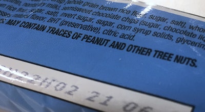 This Nov. 30, 2016, photo shows part of a food label that states the product 'may contain traces of peanut and other tree nuts' as photographed in Washington. (AP Photo / Jon Elswick)