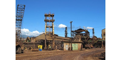 FILE - This April 27, 2010 file photo shows structures on the Hawaiian Commercial & Sugar plantation in Puunene, Hawaii. The only remaining sugar mill in Hawaii is wrapping up its last harvest. The last cane haul at Hawaiian Commercial & Sugar Company on Maui was set to take place Monday, Dec. 12, 2016. Its parent company, Alexander & Baldwin, announced in January that it would phase out sugar production this year. (AP Photo/Audrey McAvoy, File)