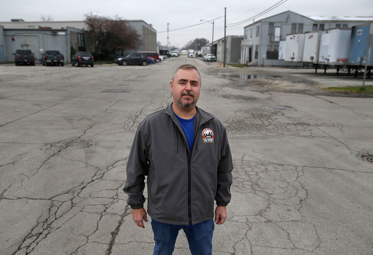 Mike Harmon, of Huntington, Ind., poses outside his union's meeting hall in Huntington, Ind., Tuesday, Dec. 6, 2016. Harmon, whose wife also works at the factory, said it's his third factory closing. He's worried he won't find anything close to the $17 an hour United Technologies provides. The couple has two children in college and two in high school and is doing what he called 'major couponing' and cutting back on non-necessities. (AP Photo/Michael Conroy)
