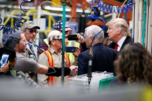 President-elect Donald Trump and Vice President-elect Mike Pence talk to workers during a visit to a Carrier factory, Thursday, Dec. 1, 2016, in Indianapolis, Ind. (AP Photo/Evan Vucci)