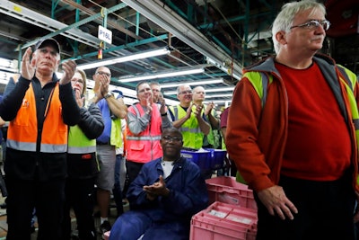 Flat Rock Assembly employees clap as Ford President and CEO Mark Fields addresses the auto plant, Tuesday, Jan. 3, 2017, in Flat Rock, Mich. (AP Photo/Carlos Osorio)
