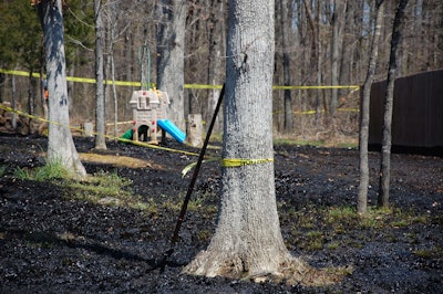 Oil covers the ground around a slide in Mayflower, Ark., days after a pipeline ruptured and spewed oil over lawns and roadways. Exxon Mobil denied claims from plaintiffs in an oil spill lawsuit that it made all information about the maintenance and repair of an oil pipeline secret. (AP Photo/Jeannie Nuss, File)