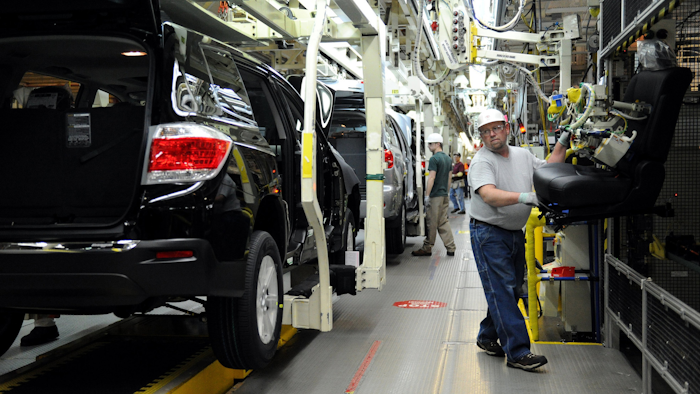 Rick Twitty installs seats into 2012 Toyota Highlander vehicles at the Toyota Motor Manufacturing Indiana, Inc., plant in Princeton, Ind. On Tuesday, Jan. 24, 2017, Toyota said it will add 400 jobs and invest $600 million at the Princeton SUV factory. (Erin McCracken / AP)