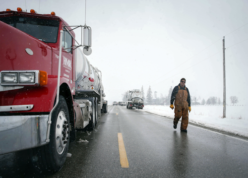 Vehicles line the shoulder of a road as crews work to clean up after a pipeline leak in Worth County, north of Hanlontown Iowa, on Wednesday, Jan. 25, 2017. According to the Worth County Sheriff's Office, approximately 82,000 gallons of diesel fuel has le