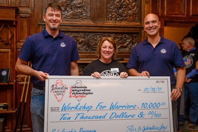 Left to Right: Workshops for Warriors Director of Development John Jones, CEO and President of Johnston Companies Susie Johnston Fox, and Workshops for Warriors CEO and Founder HernΓ‘n Luis y Prado receiving a $10,000 check from Johnston Companies to support WFW advanced manufacturing training programs.
