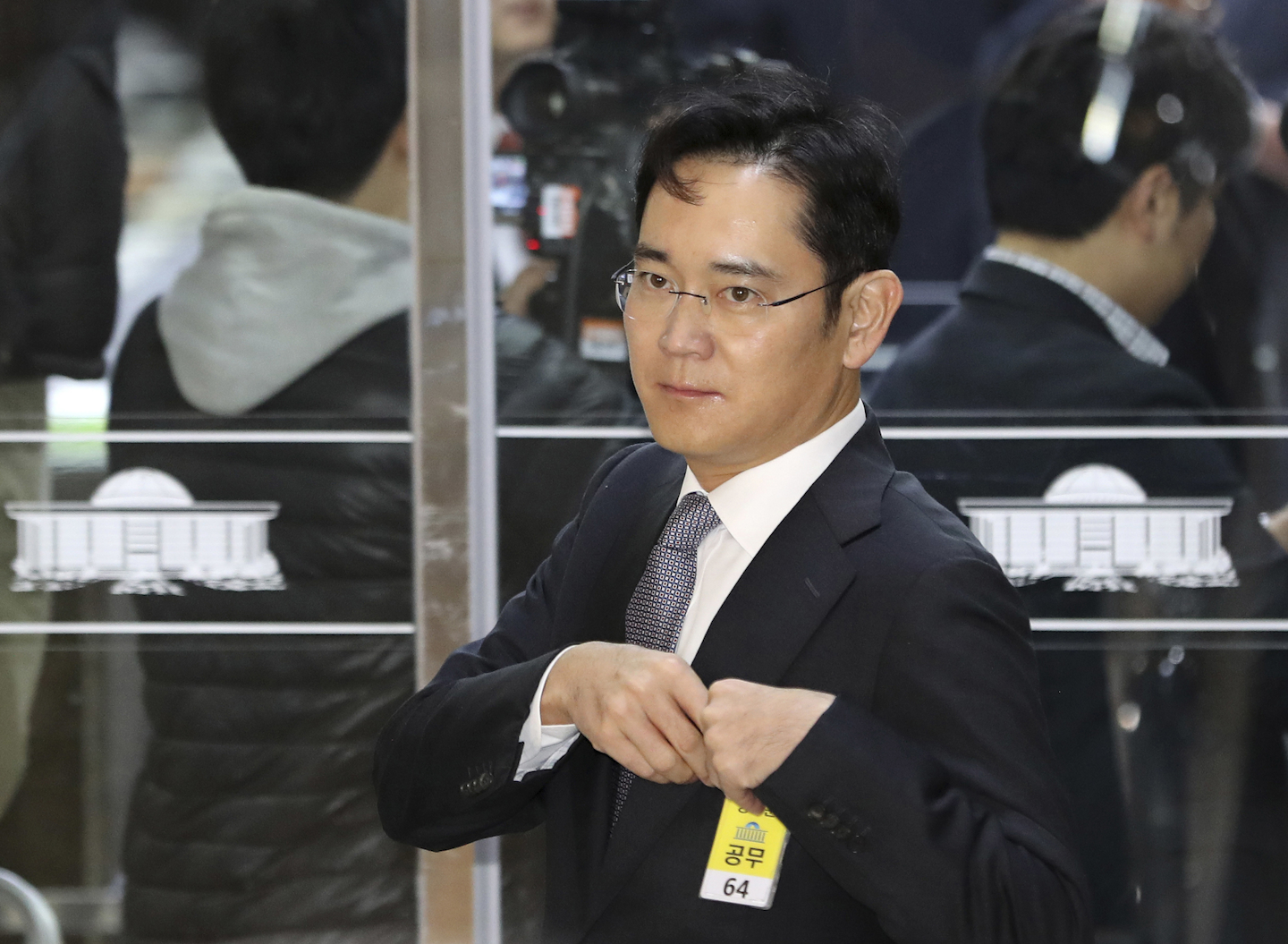 In this Dec, 6, 2016 file photo, Lee Jae-yong, a vice chairman of Samsung Electronics Co. arrives for hearing at the National Assembly in Seoul, South Korea. The special prosecutors office said Monday, Jan. 16, 2017 that it requested an arrest warrant for Lee, the 48-year-old Samsung Electronics vice chairman as a bribery suspect in the influence-peddling scandal that led to the impeachment of South Korea's president. (AP Photo/Lee Jin-man, File)